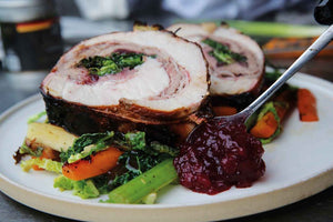 Stuffed spring roast with red wine and shallot sauce and vegetables 