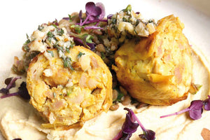 Corn-fed chicken leg deluxe “Orient-Style” with hummus, nut-mint gremolata and oriental lentil salad 