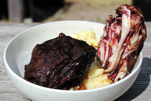 Beef cheeks in DO with lime-potato mash and grilled radicchio 