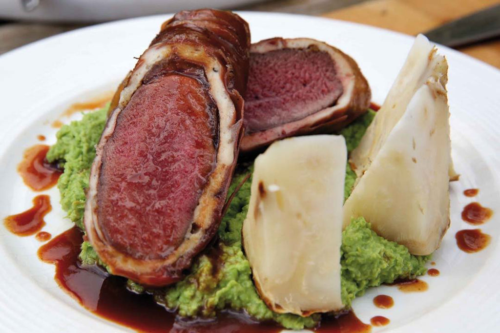 Venison saddle with thyme and pea puree 