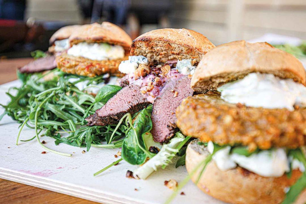 Wild and veggie burgers with avocado-chili sour cream 