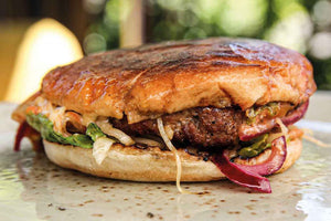 Duck crust burger with coleslaw in a brioche bun 