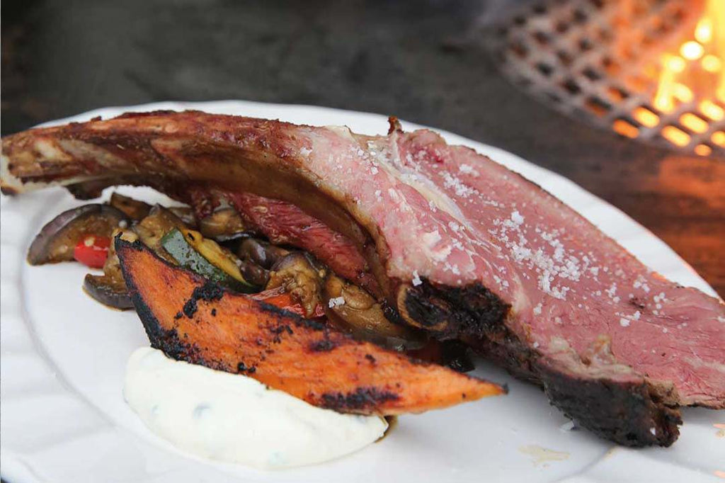 Tomahawk with sweet potatoes and vegetables 