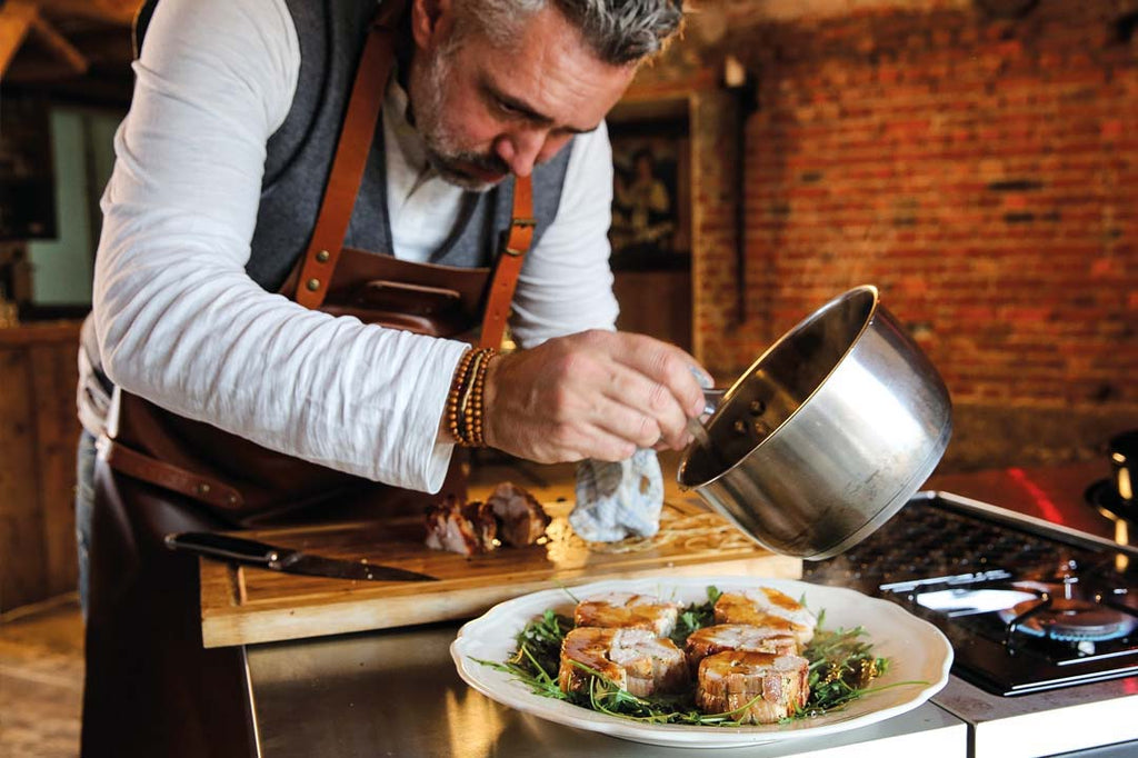 Rolled rabbit roast on rocket bed 