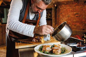 Rolled rabbit roast on rocket bed 