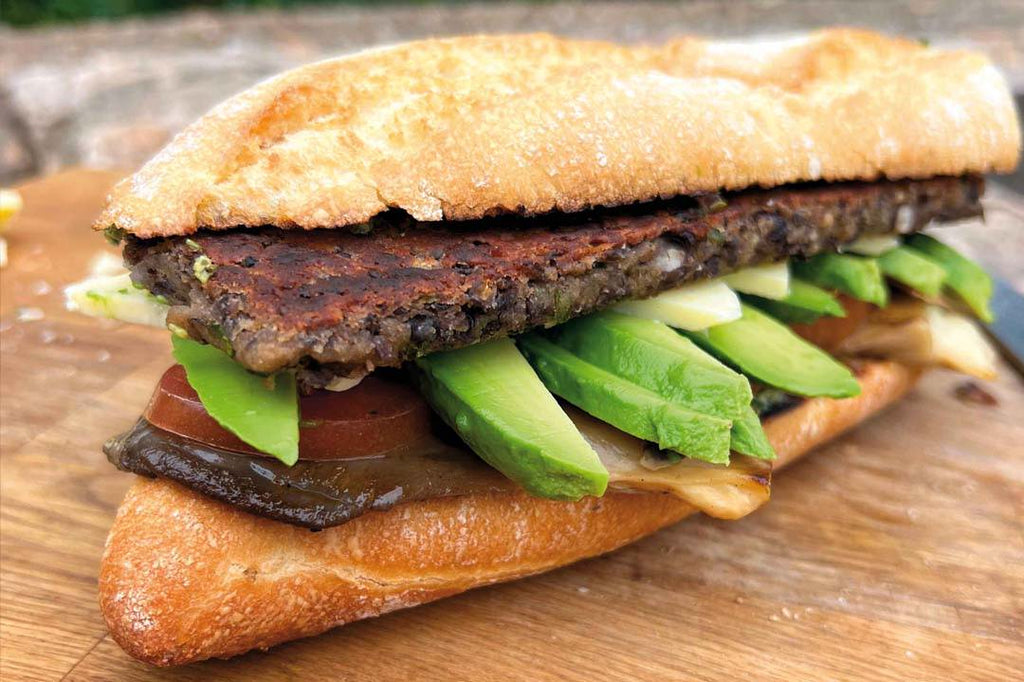 Veggie sandwich with black bean patty and mojo verde 