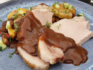 Roast pork in tobacco coating with crispy potato salad à la Kathi, chestnut crunch and black tea jus 