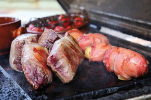 Ostrich fillet saltimbocca with truffle gnocchi and thyme honey tomatoes 